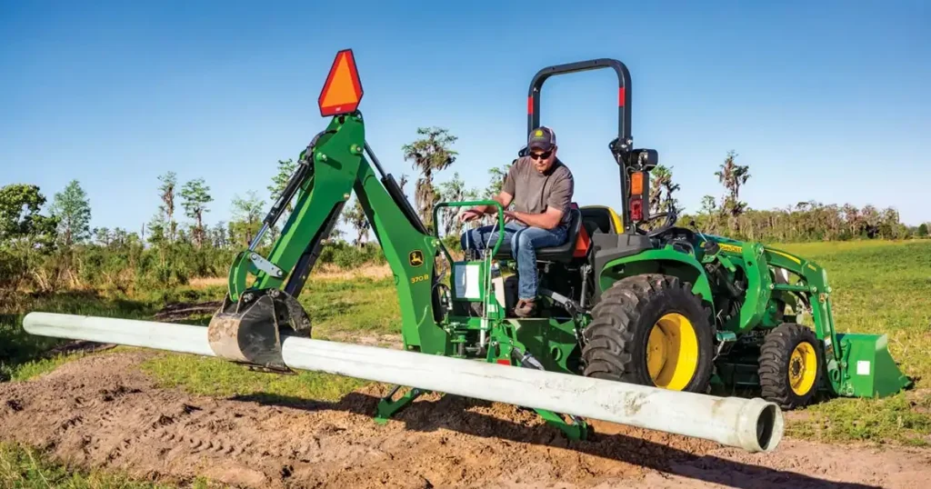 How Can Backhoe Attachments Help with Farm Drainage and Ditching Projects